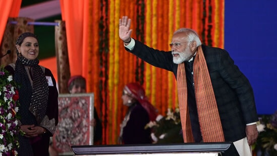 Prime Minister Narendra Modi waves at a public during the launch of various projects in Srinagar. 