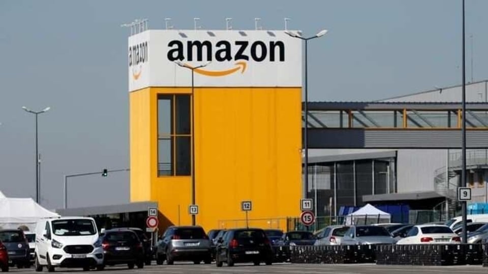 The logo of Amazon is seen at the company logistics center in Lauwin-Planque, northern France, April 22, 2020 after Amazon extended the closure of its French warehouses until April 25 included, following dispute with unions over health protection measures amid the coronavirus disease (COVID-19) outbreak.  REUTERS/Pascal Rossignol/Files
