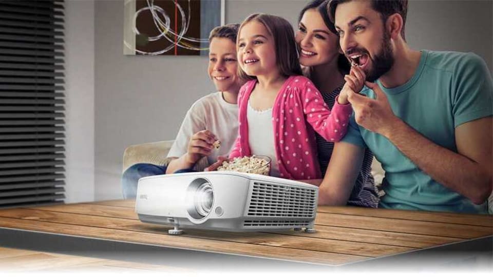 With a projector you can use a whole empty wall, if you have one, to watch shows or movies as you like. All you need to do to enhance the situation is to set it up right.