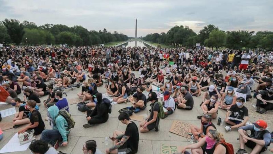 Demonstrators sit as they gather during a protest against the death in police custody of George Floyd, at the Lincoln Memorial in Washington, U.S., June 4, 2020. REUTERS/Carlos Barria/Files