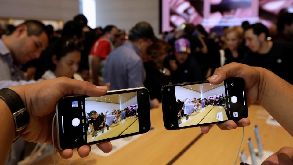 FILE PHOTO: A man shows the new iPhone 11 during the opening of Mexico's first flagship Apple store at Antara shopping mall in Mexico City, Mexico September 27, 2019. REUTERS/Luis Cortes/File Photo