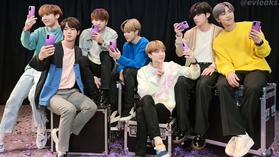 BTS members pose with their special edition of the Galaxy S20+.