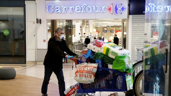 A customer pushes a shopping trolley past a Carrefour hypermaket in a shopping centre in Charenton-le-Pont near Paris during the outbreak of the coronavirus disease (COVID-19) in France