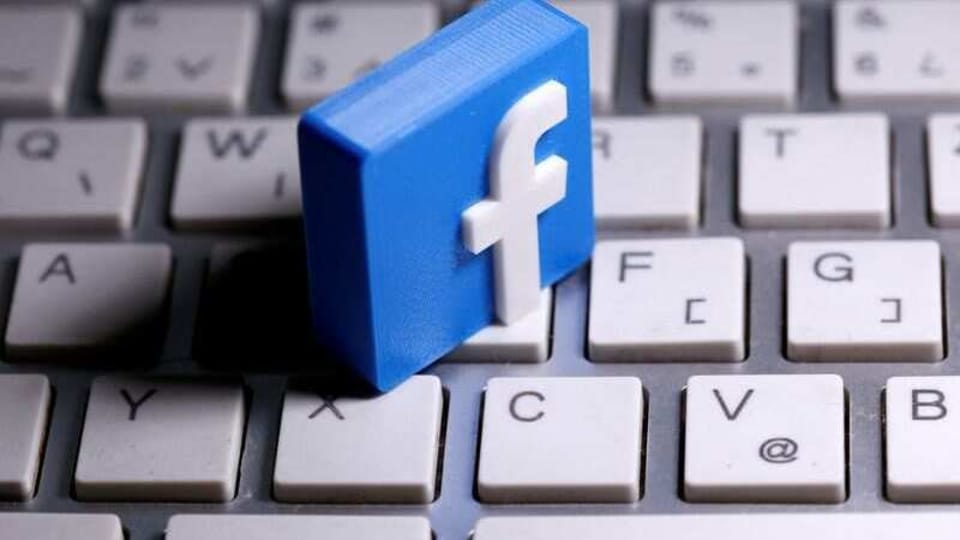 FILE PHOTO: A 3D-printed Facebook logo is seen placed on a keyboard in this illustration taken March 25, 2020. REUTERS/Dado Ruvic/Illustration/File Photo