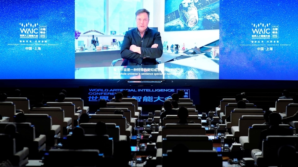 Tesla CEO Elon Musk is seen on a screen during a video message at the opening ceremony of the World Artificial Intelligence Conference (WAIC) in Shanghai on July 9. 