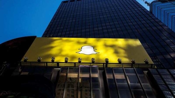 A billboard displays the logo of Snapchat above Times Square in New York.