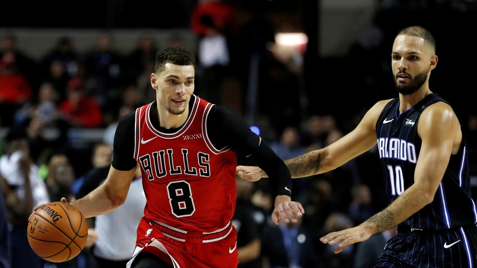 Chicago Bulls' Zach LaVine in action with Orlando Magic's Evan Fournier.