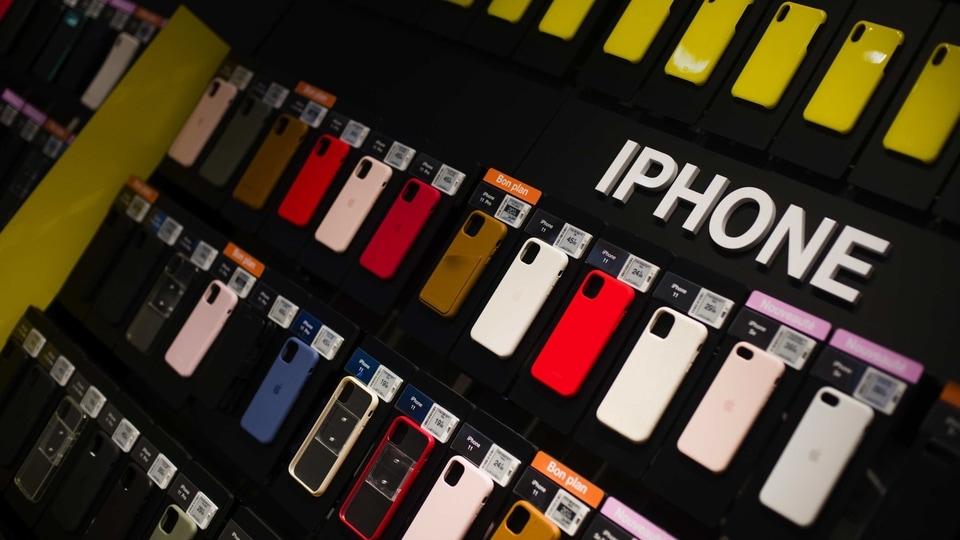 Smartphone cases for Apple Inc. devices hang in an accessories display area at the Orange SA Paris Opera boutique store in Paris, France, on Wednesday, July 29, 2020.