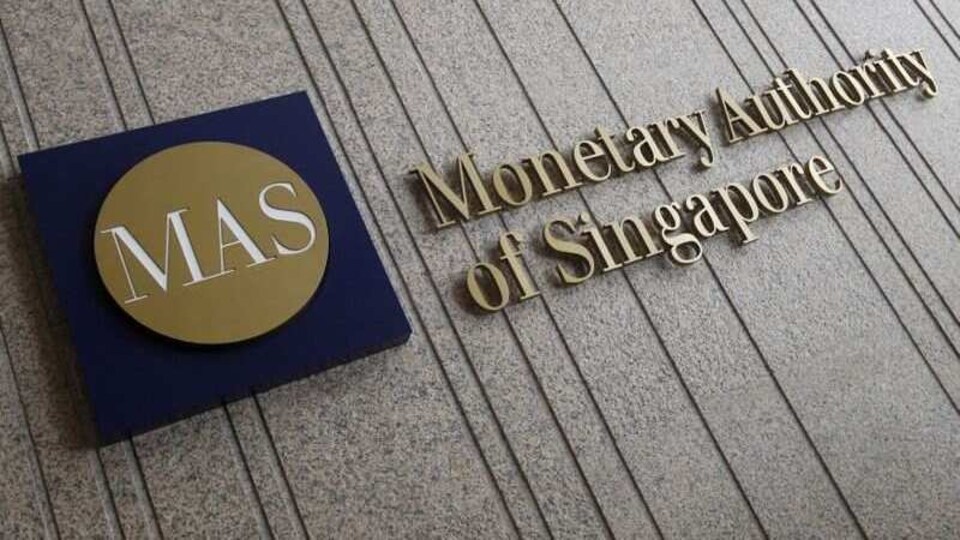 FILE PHOTO: The logo of the Monetary Authority of Singapore (MAS) is pictured at its building in Singapore in this February 21, 2013 file photo.  REUTERS/Edgar Su/File Photo