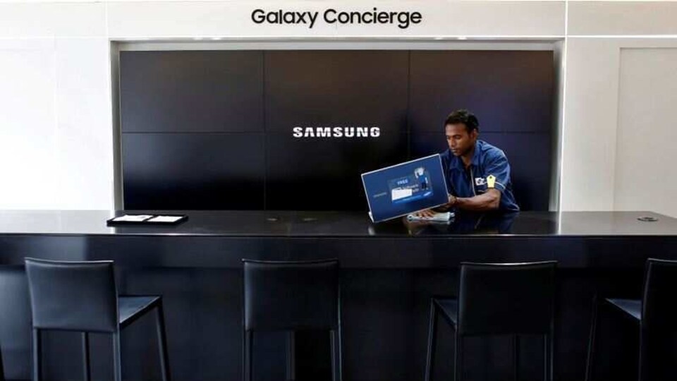 A worker cleans a Samsung showroom in New Delhi, India, July 27, 2018. Picture taken July 27, 2018.