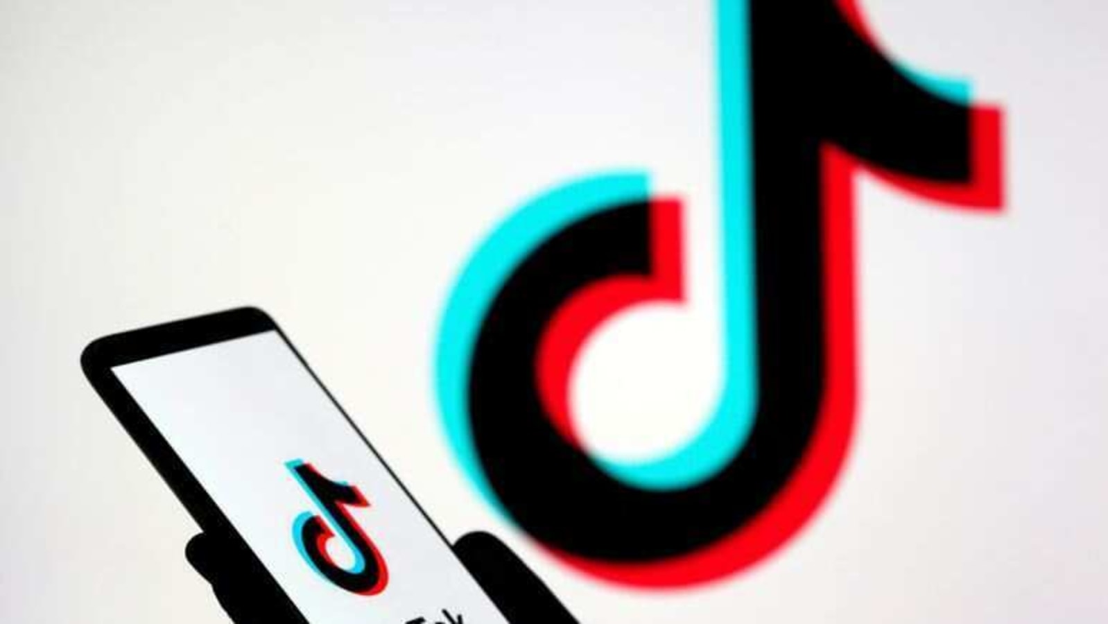 FILE PHOTO: A person holds a smartphone with the TikTok logo displayed in this picture illustration taken Nov. 7, 2019. REUTERS/Dado Ruvic/Illustration/File Photo