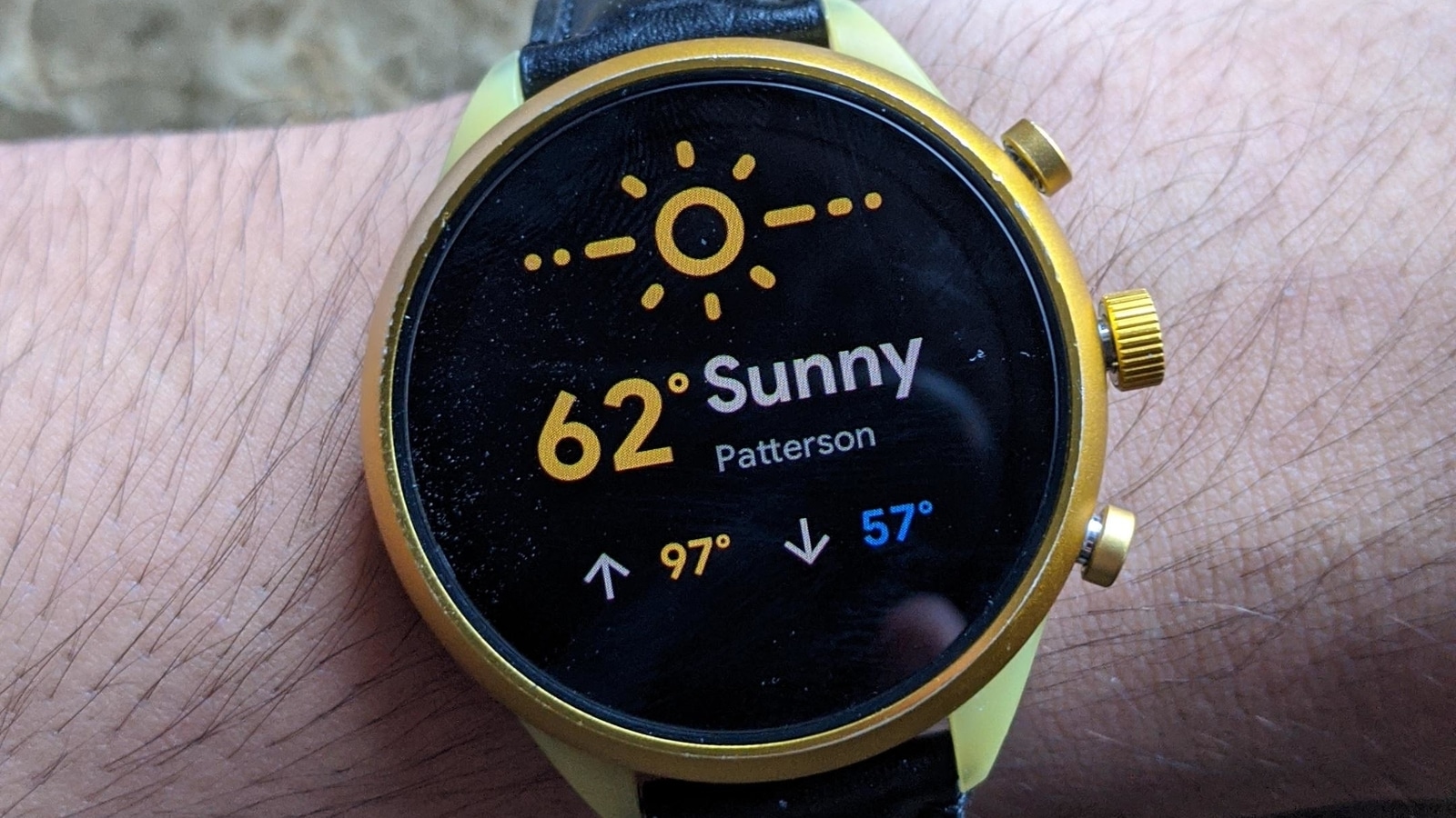 The new design features a glyph of the current weather - so you can see the sun in this case, the temperature and the location.