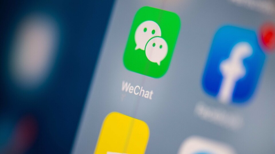 (FILES) This file illustration photo taken on July 24, 2019 in Paris shows the logo of the Chinese instant messaging application WeChat on the screen of a tablet. - The US bans on Chinese apps TikTok and WeChat are not particularly valuable for US security, experts told AFP on August 7, 2020, but could step up broader commercial pressure on Beijing and help President Donald Trump appear tough as he seeks reelection. (Photo by Martin BUREAU / AFP)