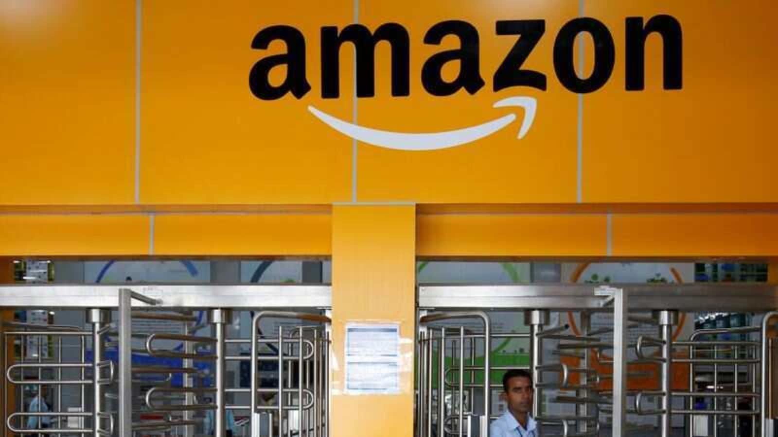 An employee of Amazon walks through a turnstile gate inside an Amazon Fulfillment Centre (BLR7) on the outskirts of Bengaluru, India, September 18, 2018.