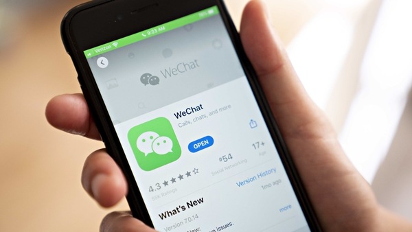 The Tencent Holdings Ltd. WeChat app is displayed in the App Store on a smartphone in an arranged photograph taken in Arlington, Virginia, U.S., on Friday, Aug. 7, 2020. President Donald Trump signed a pair of executive orders prohibiting U.S. residents from doing business with the Chinese-owned TikTok and WeChat apps beginning 45 days from now, citing the national security risk of leaving Americans' personal data exposed. Photographer: Andrew Harrer/Bloomberg