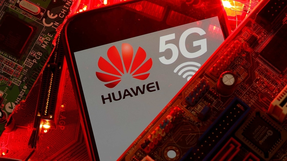 A smartphone with the Huawei and 5G network logo is seen on a PC motherboard in this illustration picture taken January 29, 2020. 