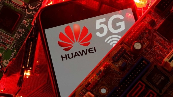 A smartphone with the Huawei and 5G network logo is seen on a PC motherboard in this illustration picture taken January 29, 2020. 