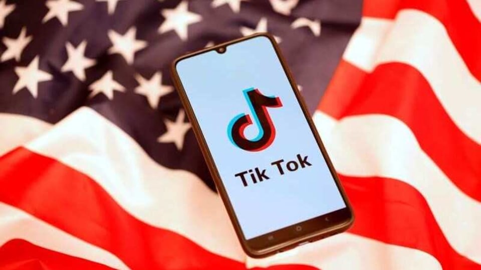 TikTok logo is displayed on the smartphone while standing on the U.S. flag in this illustration picture taken, November 8, 2019. 