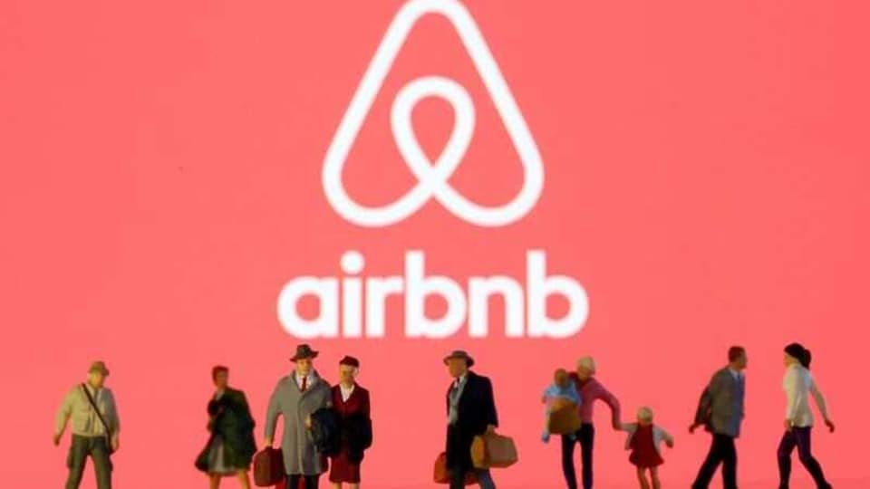 FILE PHOTO: Small toy figures are seen in front of diplayed Airbnb logo in this illustration taken March 19, 2020. REUTERS/Dado Ruvic/Illustration