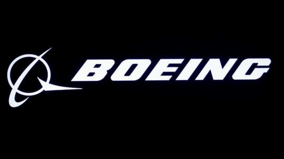 FILE PHOTO: The Boeing logo is displayed on a screen, at the New York Stock Exchange (NYSE) in New York, U.S., August 7, 2019. REUTERS/Brendan McDermid/File Photo