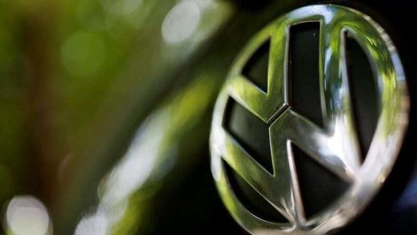 A logo of German carmaker Volkswagen is seen on a car parked on a street in Paris, France, July 9, 2020. 