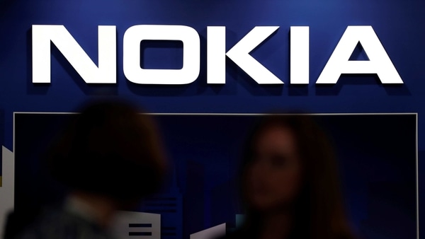 FILE PHOTO: Visitors gather outside the Nokia booth at the Mobile World Congress in Barcelona, Spain, February 26, 2019. REUTERS/Sergio Perez/File Photo