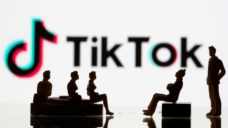 FILE PHOTO: Small toy figures are seen in front of a Tiktok logo in this illustration taken, September 9, 2020. REUTERS/Dado Ruvic/Ilustration/File Photo