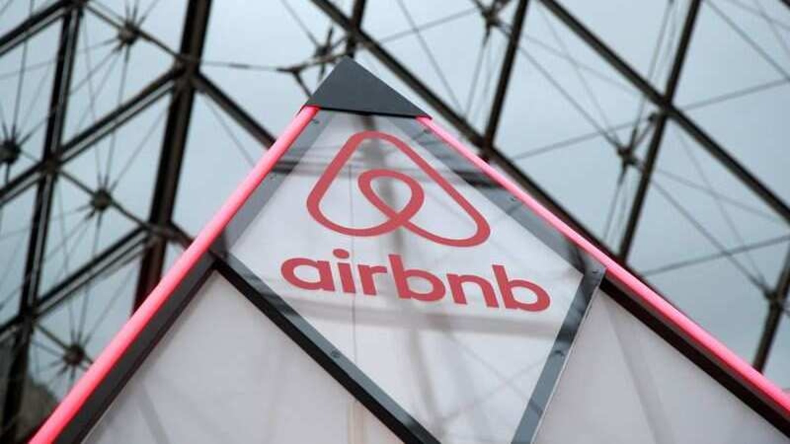 The Airbnb logo is seen on a little mini pyramid under the glass Pyramid of the Louvre museum in Paris, France, March 12, 2019. 