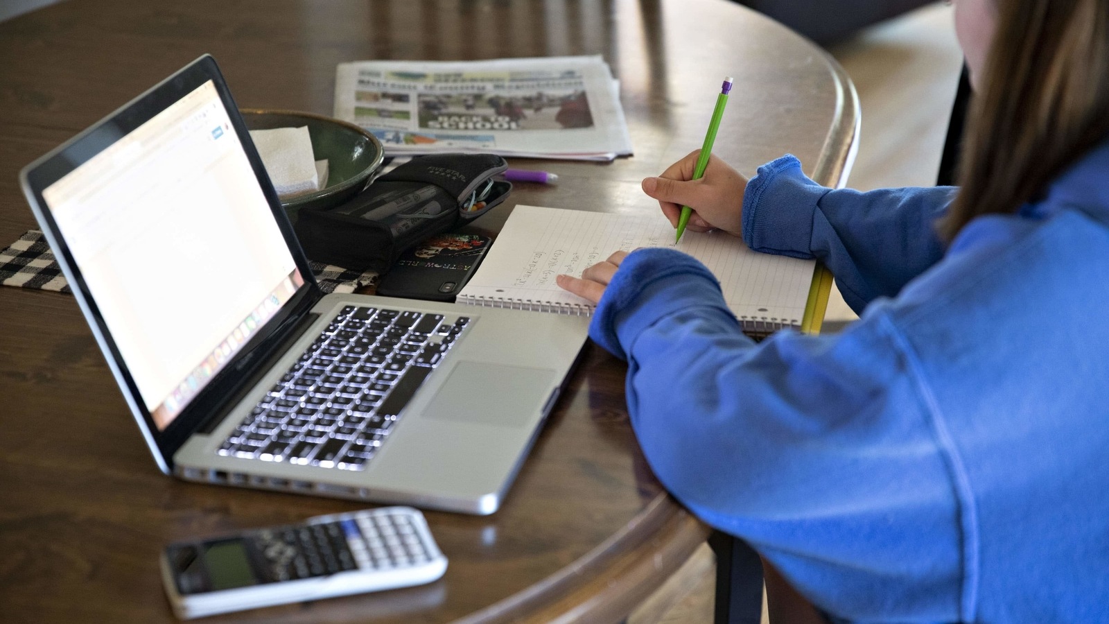 A high school student works on an assignment on a laptop computer Photographer: Daniel Acker/Bloomberg A high school student works on an assignment on a laptop computer Photographer: Daniel Acker/Bloomberg