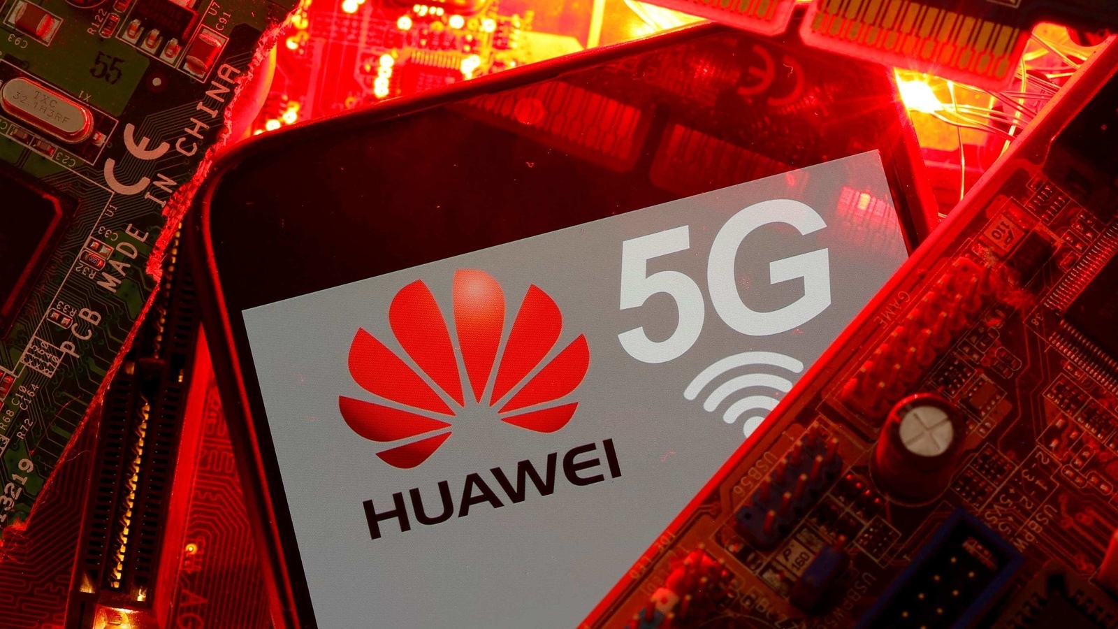 FILE PHOTO: A smartphone with the Huawei and 5G network logo is seen on a PC motherboard in this illustration picture taken January 29, 2020. REUTERS/Dado Ruvic/File Photo