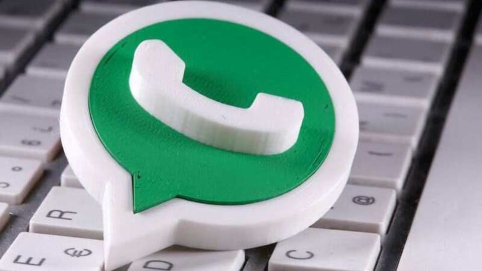 A 3D printed Whatsapp logo is placed on the keyboard in this illustration taken April 12, 2020. REUTERS/Dado Ruvic/Illustration/Files