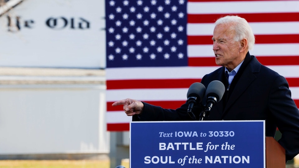 FILE PHOTO: Joe Biden points a finger as he speaks during a drive-in campaign stop, in Des Moines, Iowa, U.S., October 30, 2020.   REUTERS/Brian Snyder/File Photo