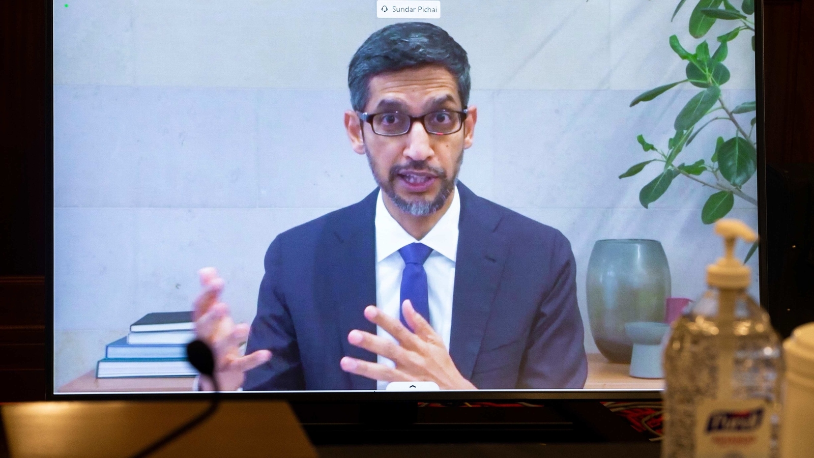 Google CEO Sundar Pichai appears on a screen as he speaks remotely during a hearing before the Senate Commerce Committee on Capitol Hill, Wednesday, Oct. 28, 2020, in Washington. The committee summoned the CEOs of Twitter, Facebook and Google to testify during the hearing. (Michael Reynolds/Pool via AP)