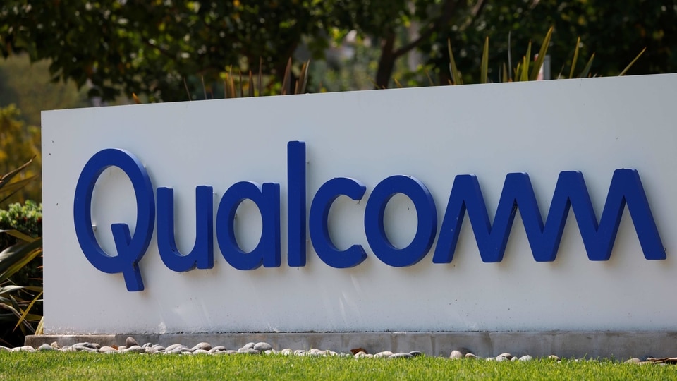 FILE PHOTO: A Qualcomm sign is shown outside one of the company's many buildings in San Diego, California, U.S., September 17, 2020. REUTERS/Mike Blake/File Photo