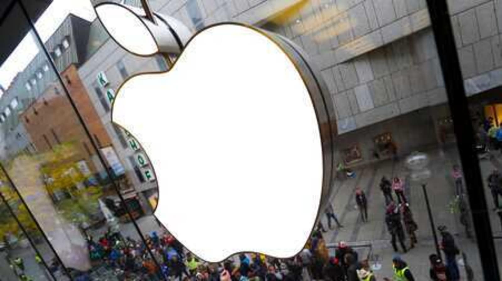 FILE-In this Sept. 25, 2015 file photo people wait in front of the Apple store in Munich, Germany. IDFA (Apple’s Identifier for Advertisers) allows Apple and all apps on the phone to track a user and combine information about online and mobile behaviour. Just like for cookies, this would require the users’ consent under EU law. Apple places these tracking codes without the knowledge or agreement of the users. noyb therefore filed two complaints against the company. (AP Photo/Matthias Schrader)