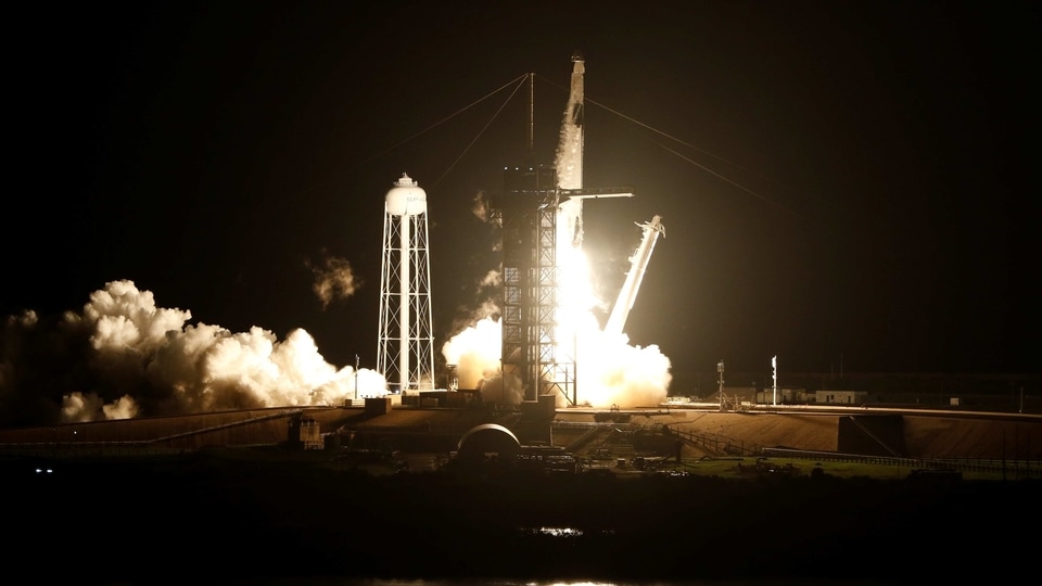 A SpaceX Falcon 9 rocket, topped with the Crew Dragon capsule, is launched carrying four astronauts on the first operational NASA commercial crew mission at Kennedy Space Center in Cape Canaveral, Florida, US November 15, 2020. 