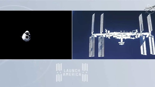 This NASA TV video grab shows Nasa's SpaceX Crew-1 mission aboard the SpaceX Crew Dragon (R) as it approaches the International Space Station (L) on November 16. 