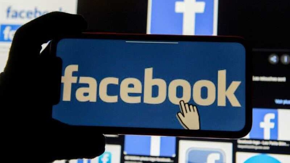 The Facebook logo is displayed on a mobile phone in this picture illustration taken December 2, 2019. REUTERS/Johanna Geron/Illustration/File Photo