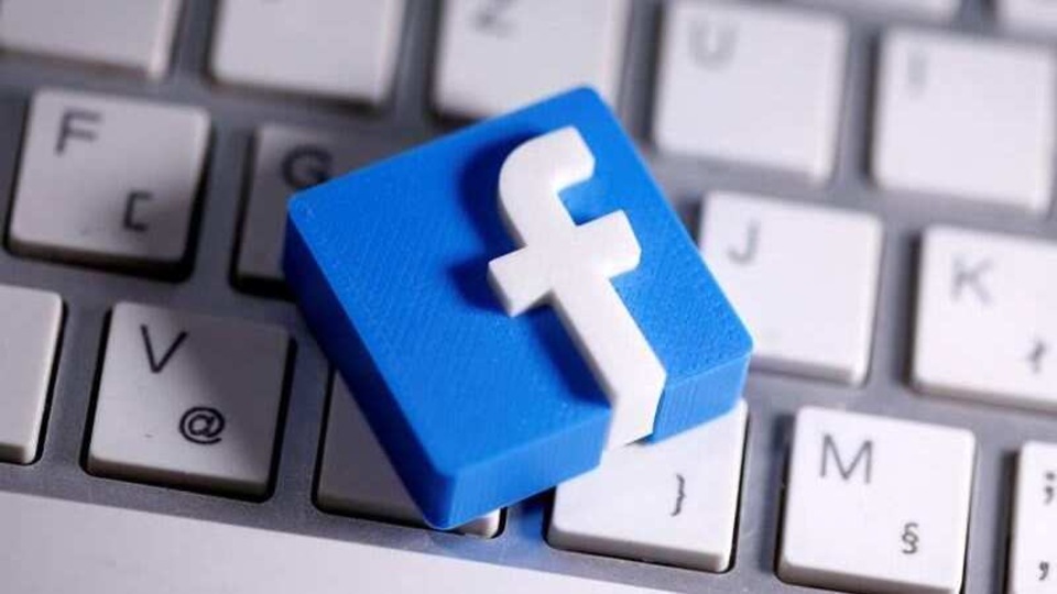 FILE PHOTO: 3D-printed Facebook logo is seen placed on a keyboard in this illustration taken March 25, 2020. REUTERS/Dado Ruvic/Illustration