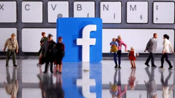 FILE PHOTO: A 3D printed Facebook logo is placed between small toy people figures in front of a keyboard in this illustration taken April 12, 2020. REUTERS/Dado Ruvic/Illustration/File Photo