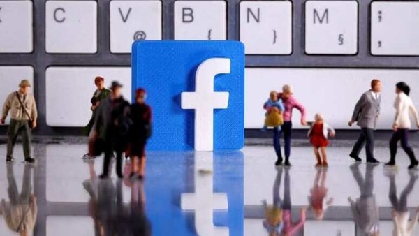 FILE PHOTO: A 3D printed Facebook logo is placed between small toy people figures in front of a keyboard in this illustration taken April 12, 2020. REUTERS/Dado Ruvic/Illustration/File Photo