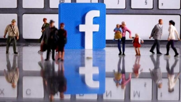 FILE PHOTO: A 3D printed Facebook logo is placed between small toy people figures in front of a keyboard in this illustration taken April 12, 2020. REUTERS/Dado Ruvic/Illustration/File Photo