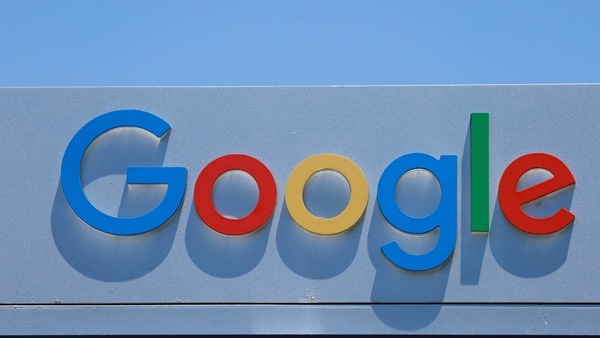 FILE PHOTO: After the company announced it would extend its coronavirus work-from-home order until summer 2021, a Google sign is shown at one of the company's office complexes in Irvine, California, U.S., July 27, 2020. REUTERS/Mike Blake/File Photo