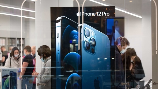 An iPhone 12 Pro display in the window of an Apple Inc. store at the Aviapark shopping center, Russia's largest shopping mall, in the Khoroshyovsky District of Moscow, Russia, on Friday, Nov. 27, 2020. A worsening Covid-19 outbreak is threatening Russia's economy with another contraction, after a swifter-than-expected rebound in 3Q. Photographer: Andrey Rudakov/Bloomberg