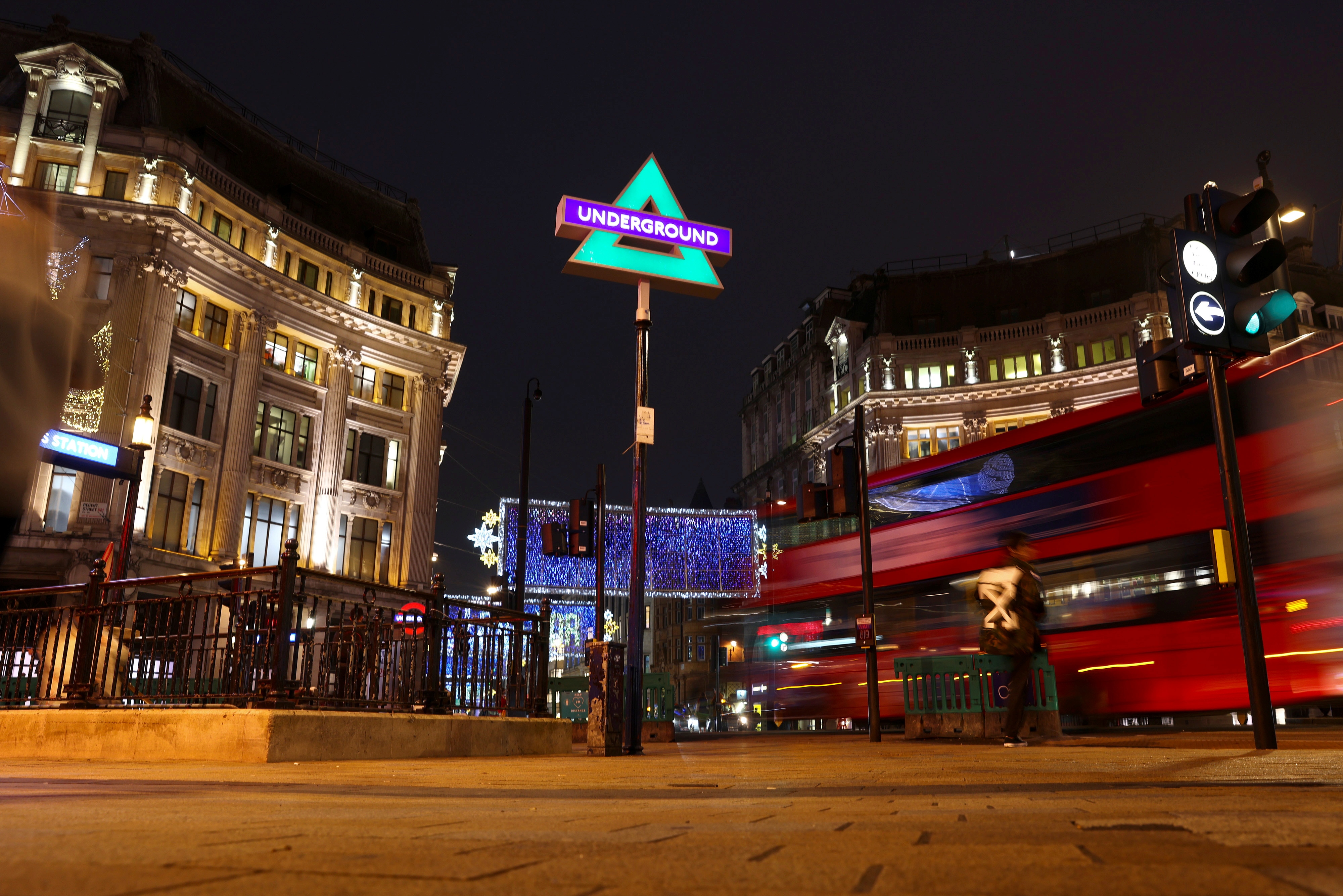 Sony Playstation 5 branding is displayed outside the Oxford Circus underground on the platform of the tube station, in London
