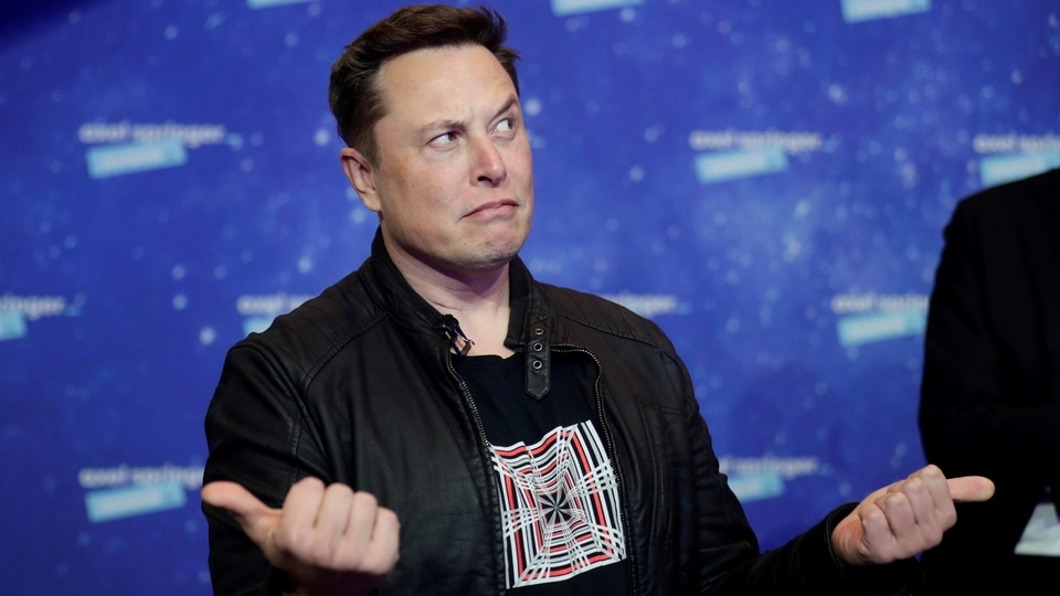 FILE PHOTO: SpaceX owner and Tesla CEO Elon Musk grimaces after arriving on the red carpet for the Axel Springer award, in Berlin, Germany, December 1, 2020. REUTERS/Hannibal Hanschke/File Photo