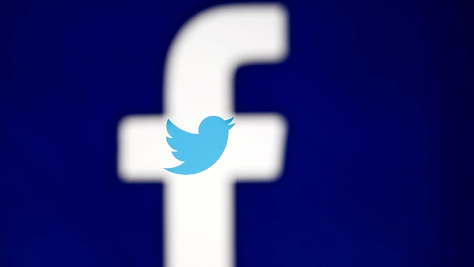 FILE PHOTO: A 3D-printed Facebook logo is displayed in front of the Twitter logo, in this illustration taken October 25, 2017. REUTERS/Dado Ruvic/Illustration/File Photo