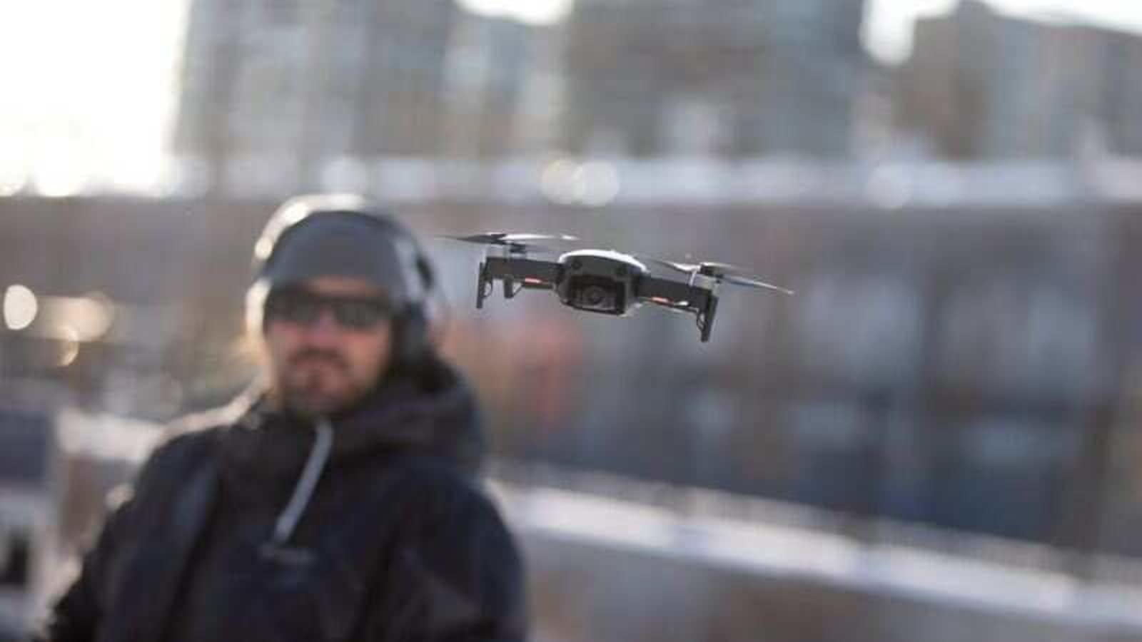 A drone operator flies his drone as Chinese drone maker DJI holds a demonstration to display an app that tracks a drone's registration and owner in Montreal, Canada, November 13, 2019. REUTERS/Christinne Muschi