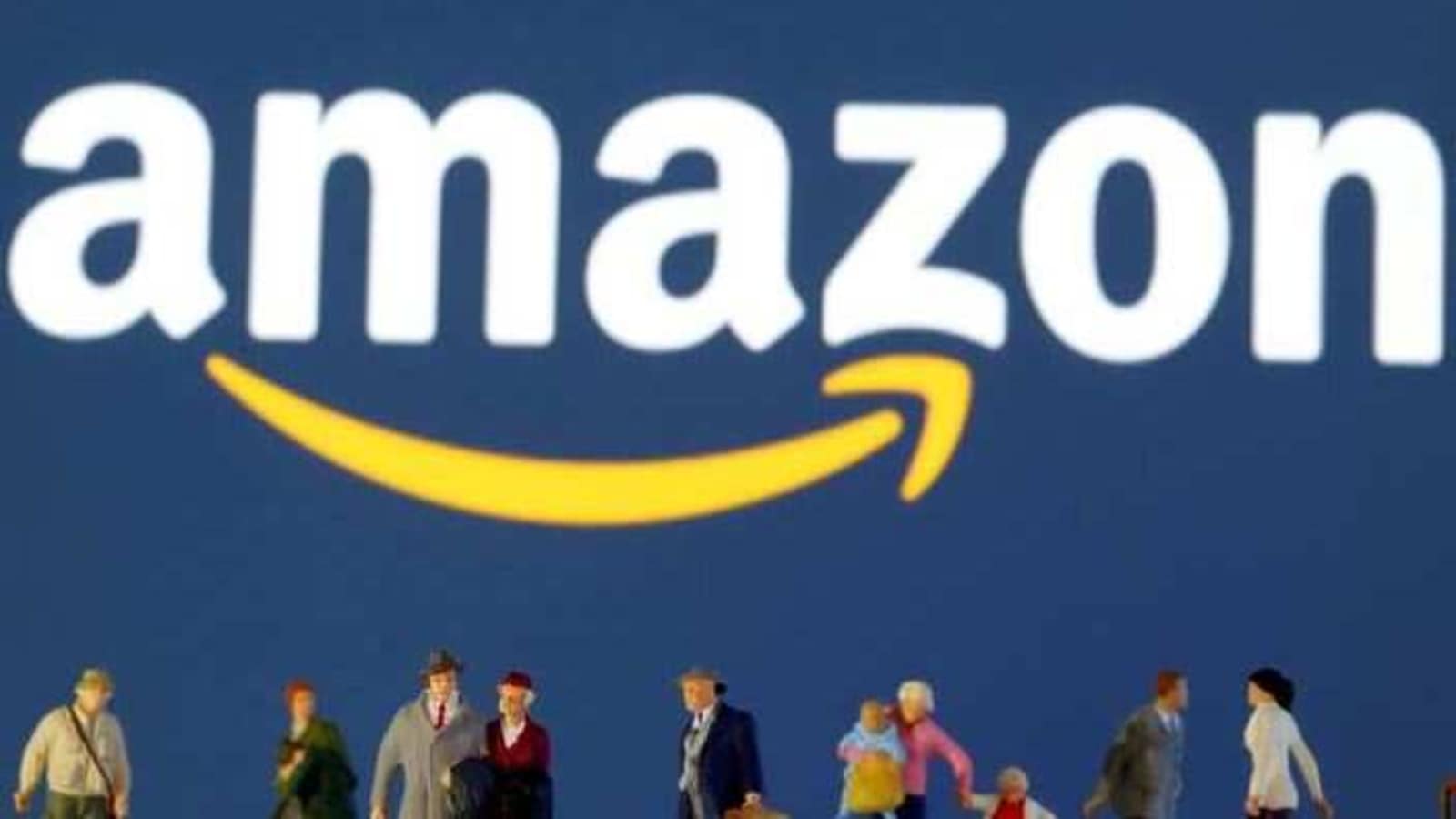 FILE PHOTO: Small toy figures are seen in front of diplayed Amazon logo in this illustration taken March 19, 2020. REUTERS/Dado Ruvic/Illustration/File Photo