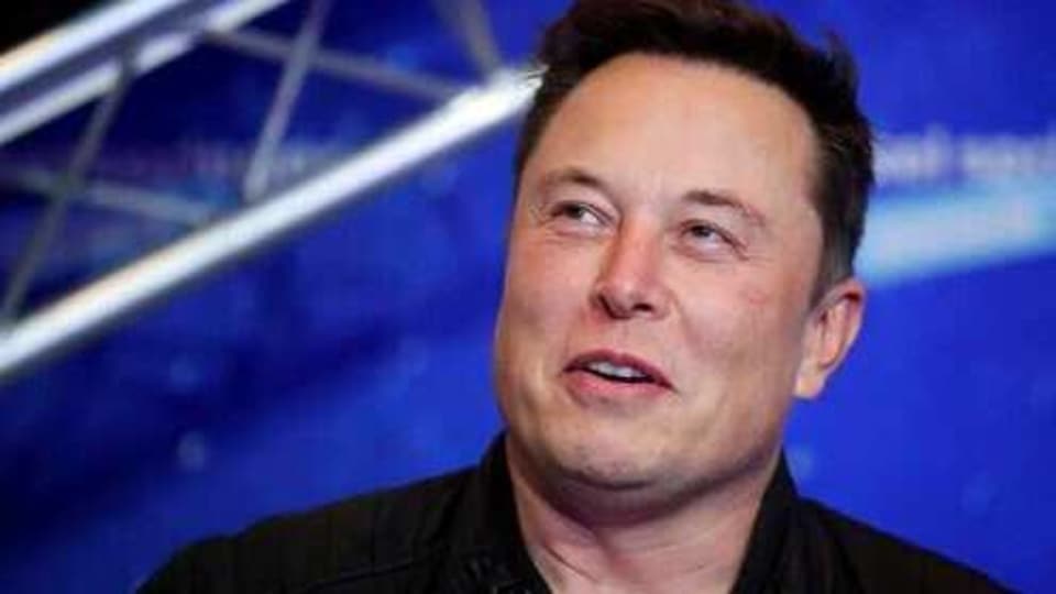FILE - In this Tuesday, Dec. 1, 2020, file photo, SpaceX owner and Tesla CEO Elon Musk arrives on the red carpet for the Axel Springer media award, in Berlin. In a tweet Tuesday, Dec. 22, 2020, Musk said he once considered selling the electric car maker to Apple, but the iPhone maker’s CEO Tim Cook blew off the meeting. (Hannibal Hanschke/Pool Photo via AP, File)